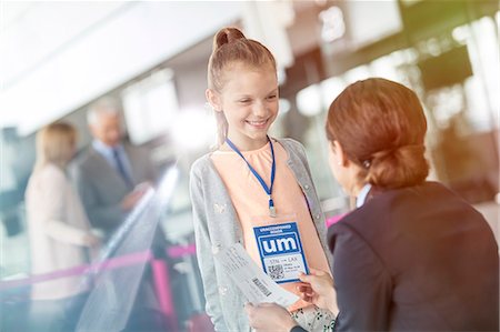 service - Flight attendant talking to girl in airport Stock Photo - Premium Royalty-Free, Code: 6113-08784190