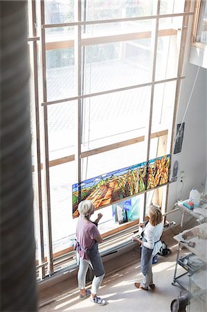 Artists finishing stained glass at studio window Stock Photo - Premium Royalty-Free, Code: 6113-08784392