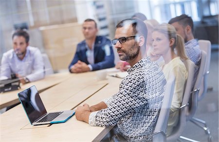 simsearch:6113-07565805,k - Business people listening in conference room meeting Stock Photo - Premium Royalty-Free, Code: 6113-08784467