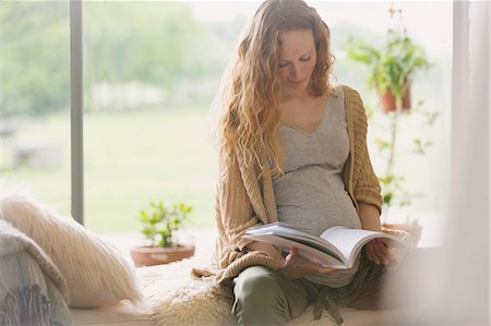 people sitting in chaise lounge - Pregnant woman reading book Stock Photo - Premium Royalty-Free, Code: 6113-08722087