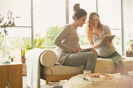 simsearch:6113-06753677,k - Pregnant women using digital tablet in living room Stock Photo - Premium Royalty-Free, Code: 6113-08722017
