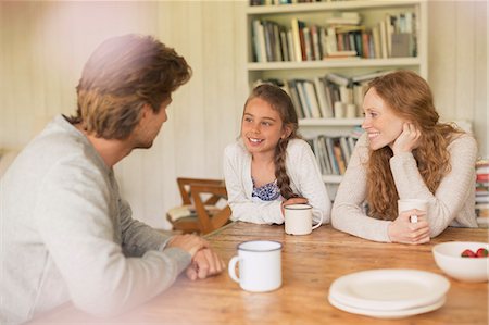 family dining room table - Family drinking tea and talking at dining table Stock Photo - Premium Royalty-Free, Code: 6113-08722032
