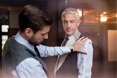 rich man and luxury - Tailor fitting businessman for suit in menswear shop Stock Photo - Premium Royalty-Free, Code: 6113-08722348