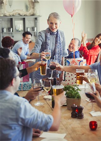 simsearch:6113-06909171,k - Friends toasting wine and beer glasses at restaurant birthday party Stock Photo - Premium Royalty-Free, Code: 6113-08882579