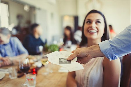 simsearch:700-00085293,k - Waiter returning bill and credit card to woman dining at restaurant table Stock Photo - Premium Royalty-Free, Code: 6113-08882680