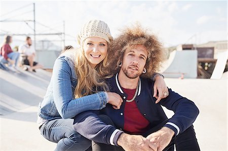 simsearch:6113-06720867,k - Portrait smiling couple at sunny skate park Stock Photo - Premium Royalty-Free, Code: 6113-08882722