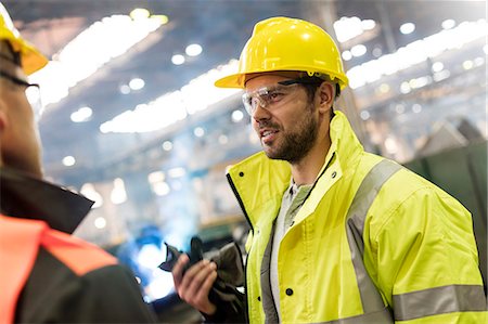 simsearch:6113-08805556,k - Steel workers talking in factory Stock Photo - Premium Royalty-Free, Code: 6113-08805574