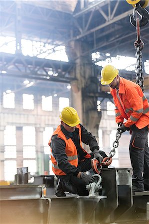 simsearch:6113-08805556,k - Steel workers fastening crane chain to steel in factory Stock Photo - Premium Royalty-Free, Code: 6113-08805579