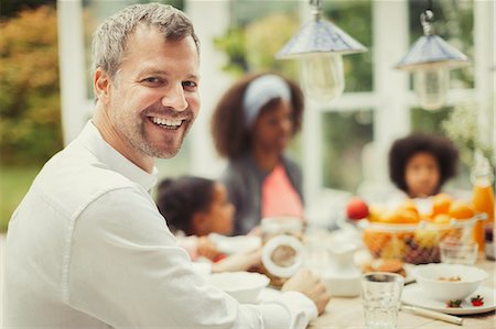 simsearch:6113-07565751,k - Portrait enthusiastic father with family at breakfast table Stock Photo - Premium Royalty-Free, Code: 6113-08943577
