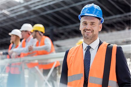 simsearch:632-03403433,k - Portrait confident businessman in hard-hat at construction site Stock Photo - Premium Royalty-Free, Code: 6113-08943898
