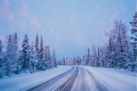 simsearch:6118-08521813,k - Remote winter road through snow covered forest trees against blue sky, Lapland, Finland Stock Photo - Premium Royalty-Free, Code: 6113-08943961