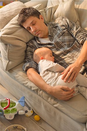 simsearch:614-07031850,k - Exhausted father and baby son sleeping on sofa Stock Photo - Premium Royalty-Free, Code: 6113-08947278