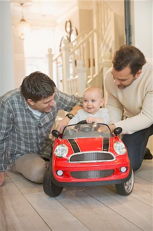 simsearch:6113-07648804,k - Male gay parents and baby son playing with toy car Stock Photo - Premium Royalty-Free, Code: 6113-08947288