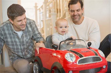 simsearch:6113-07648804,k - Male gay parents and baby son playing with toy car Stock Photo - Premium Royalty-Free, Code: 6113-08947299