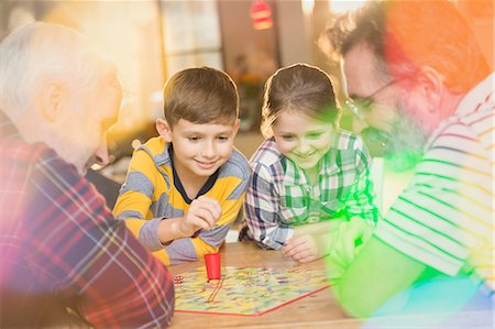 preteen boys playing - Male gay parents and children playing board game Stock Photo - Premium Royalty-Free, Code: 6113-08947212