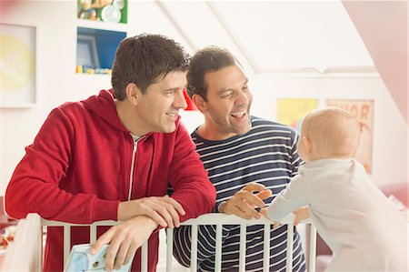simsearch:6113-07648804,k - Male gay parents watching baby son in crib Stock Photo - Premium Royalty-Free, Code: 6113-08947333