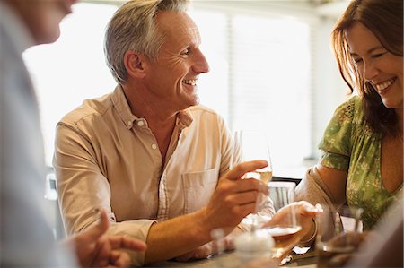 simsearch:6113-07790692,k - Smiling mature couple drinking wine, dining at restaurant table Stock Photo - Premium Royalty-Free, Code: 6113-08985719