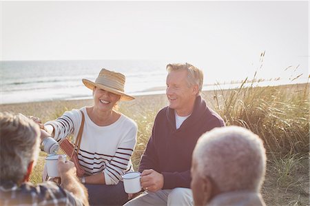 simsearch:6113-07242109,k - Senior couples drinking coffee on sunny beach Stock Photo - Premium Royalty-Free, Code: 6113-08985728