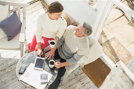 simsearch:6113-07762308,k - View from above mature couple drinking coffee and using digital tablet on sun porch Stock Photo - Premium Royalty-Free, Code: 6113-08985809