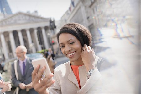 simsearch:6113-07543477,k - Smiling businesswoman taking selfie with camera phone, London, UK Stock Photo - Premium Royalty-Free, Code: 6113-08986059
