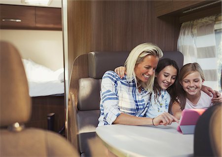 simsearch:6113-07730567,k - Smiling mother and daughters using digital tablet inside motor home Stock Photo - Premium Royalty-Free, Code: 6113-08909870