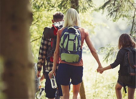 simsearch:649-08306780,k - Mother and daughter with backpacks holding hands hiking in woods Stock Photo - Premium Royalty-Free, Code: 6113-08909931