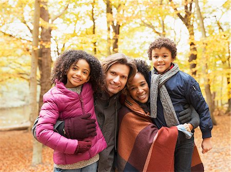 simsearch:6113-07159174,k - Portrait smiling young family in autumn park Stock Photo - Premium Royalty-Free, Code: 6113-08910081