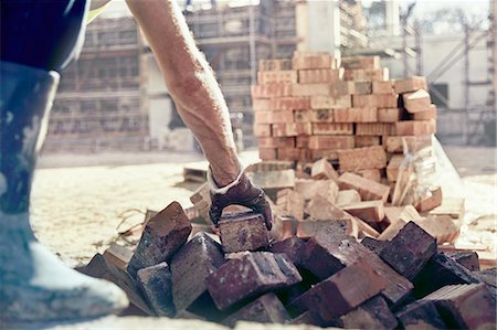 Construction worker bricklaying at construction site Stock Photo - Premium Royalty-Free, Code: 6113-08910039