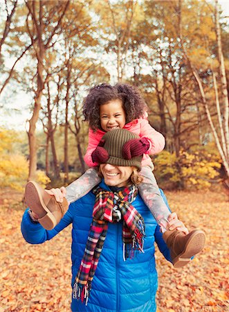 simsearch:649-06623087,k - Portrait playful daughter pulling stocking cap over fathers eyes in autumn park Stock Photo - Premium Royalty-Free, Code: 6113-08910191