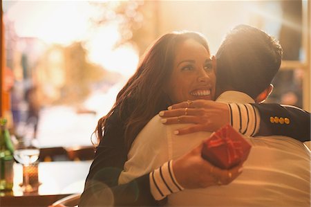 simsearch:6113-07565751,k - Happy woman receiving gift and hugging boyfriend Stock Photo - Premium Royalty-Free, Code: 6113-08927699