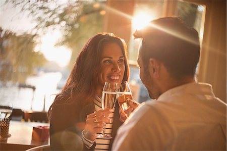 simsearch:6113-07565751,k - Affectionate young couple toasting champagne glasses in restaurant Stock Photo - Premium Royalty-Free, Code: 6113-08927706