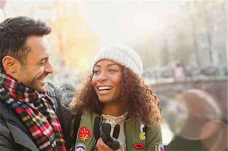 simsearch:6113-07543572,k - Laughing young couple along autumn canal Foto de stock - Sin royalties Premium, Código: 6113-08927739