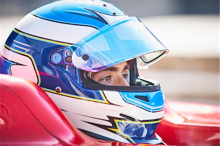 simsearch:632-03403433,k - Close up formula one race car driver in helmet looking away Stock Photo - Premium Royalty-Free, Code: 6113-08927833