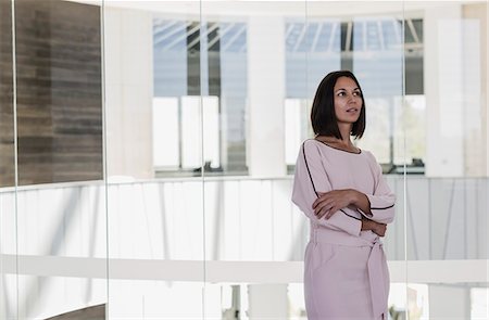 simsearch:649-07119200,k - Pensive businesswoman looking away in office Stock Photo - Premium Royalty-Free, Code: 6113-09058653