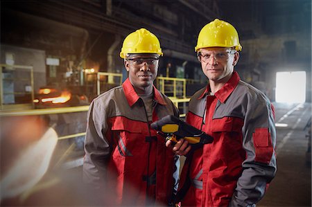 facing camera - Portrait confident steelworkers with digital tablet in steel mill Stock Photo - Premium Royalty-Free, Code: 6113-09059064