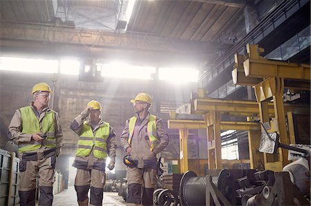 foundry worker - Steelworkers walking and talking in steel mill Stock Photo - Premium Royalty-Free, Code: 6113-09059019