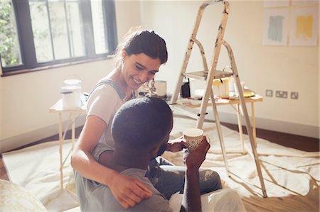simsearch:6113-07147136,k - Affectionate young couple painting living room Stock Photo - Premium Royalty-Free, Code: 6113-09059216