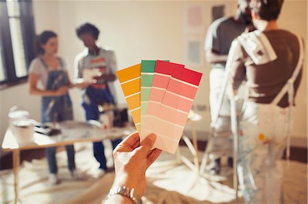 simsearch:6113-07147136,k - Personal perspective friends viewing color swatches, painting living room Stock Photo - Premium Royalty-Free, Code: 6113-09059370