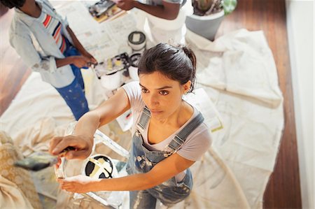 painting, drop cloth - Young woman painting living room Stock Photo - Premium Royalty-Free, Code: 6113-09059326