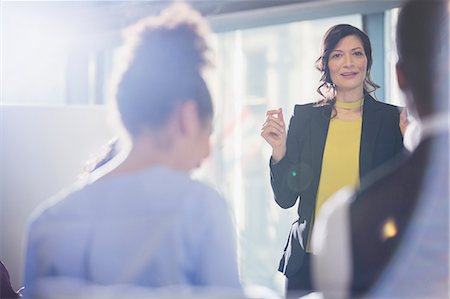 province of latina - Smiling businesswoman leading conference presentation Stock Photo - Premium Royalty-Free, Code: 6113-09004995