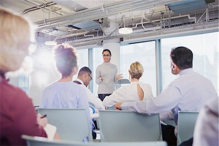 Businesswoman leading conference room meeting Stock Photo - Premium Royalty-Free, Code: 6113-09004908