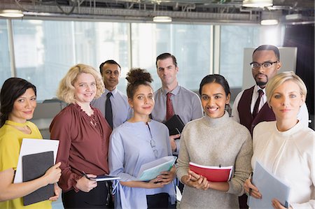 simsearch:649-02667002,k - Portrait smiling business people with paperwork in conference room Stock Photo - Premium Royalty-Free, Code: 6113-09004919