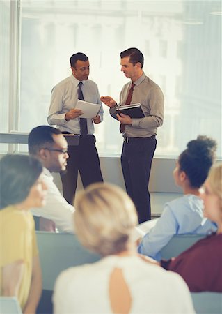 simsearch:6113-06899132,k - Businessmen talking in conference audience Stock Photo - Premium Royalty-Free, Code: 6113-09005003