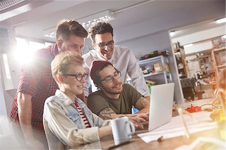 programming - Designers working at laptop in workshop Stock Photo - Premium Royalty-Free, Code: 6113-09005169