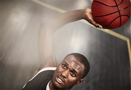 simsearch:400-05112689,k - Overhead view determined young male basketball player shooting the ball Stock Photo - Premium Royalty-Free, Code: 6113-09005132