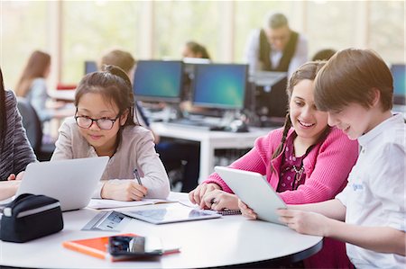 simsearch:649-07280058,k - Students using digital tablet and laptop in library Stock Photo - Premium Royalty-Free, Code: 6113-09027255