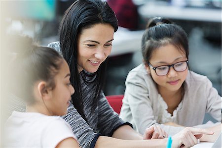 simsearch:614-07031973,k - Female teacher and girl students using laptop in classroom Stock Photo - Premium Royalty-Free, Code: 6113-09027276