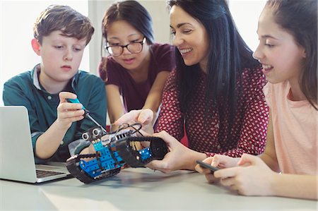 simsearch:649-07280058,k - Female teacher and students programming and assembling robotics in classroom Stock Photo - Premium Royalty-Free, Code: 6113-09027303