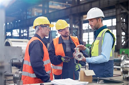 simsearch:649-07238739,k - Male engineers discussing steel part in factory Stock Photo - Premium Royalty-Free, Code: 6113-09027496
