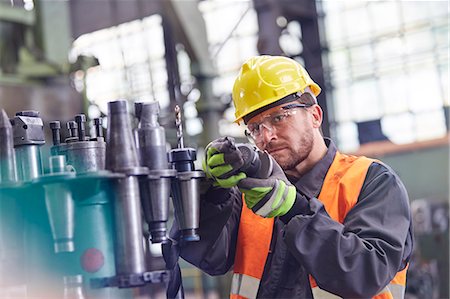 simsearch:649-07238739,k - Male worker examining steel parts in factory Stock Photo - Premium Royalty-Free, Code: 6113-09027546